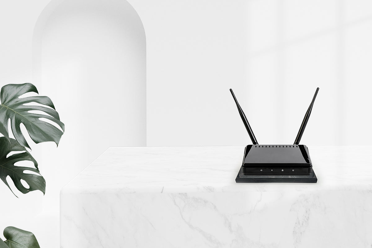 Charging plate with router on white surface.