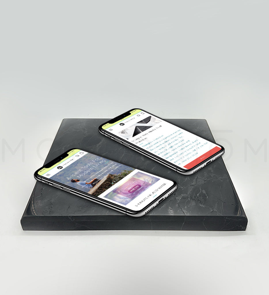Charging plate with two phones displayed on it.