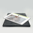 Load image into Gallery viewer, Tablet charging on a black plate