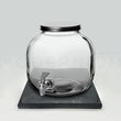 Load image into Gallery viewer, Glass beverage dispenser on black charging plate