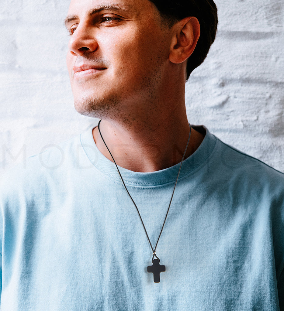 Man wearing Cross pendant necklace