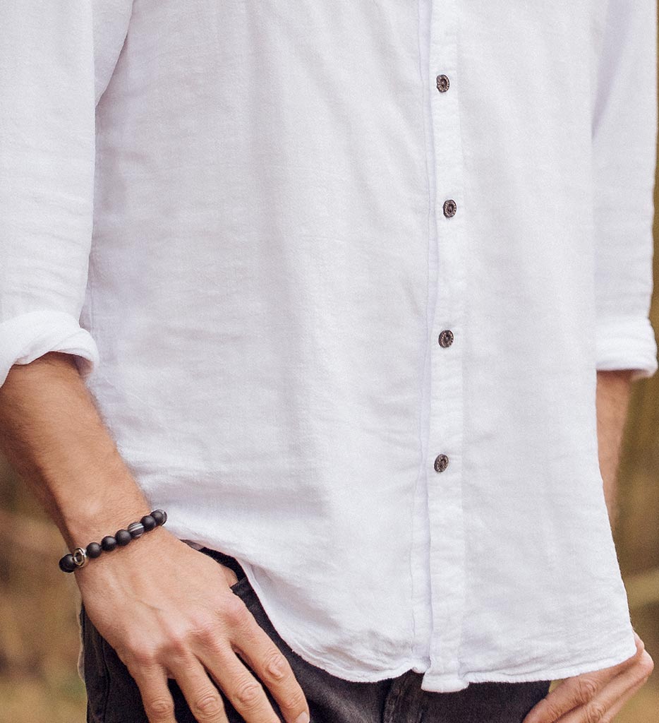 Man in white shirt wearing bracelet, MG_9215DZI