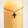 Load image into Gallery viewer, Shungite cross necklace on candle