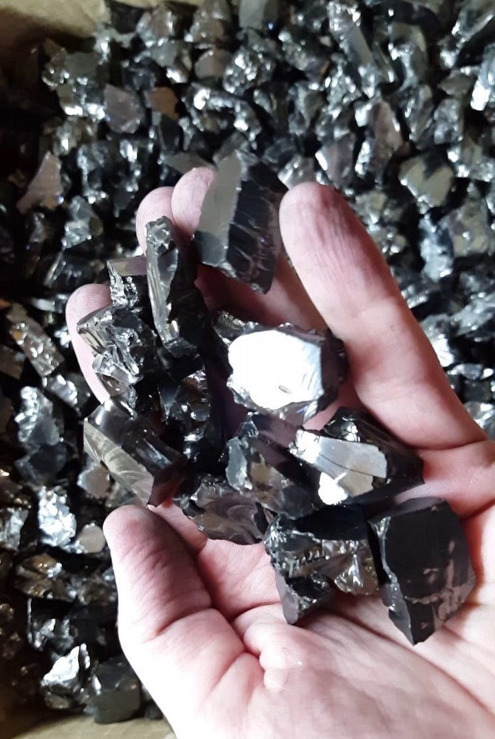 Handful of black obsidian rocks