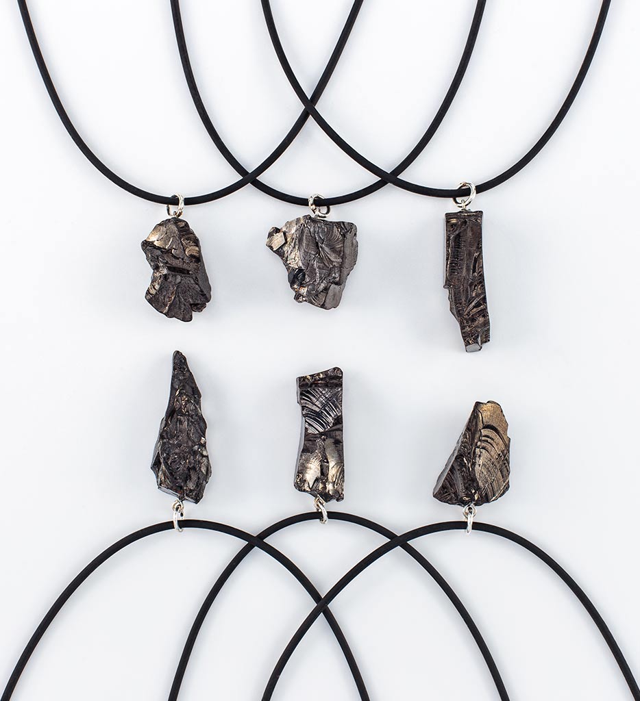 Meteorite pendants on black cords