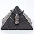 Load image into Gallery viewer, Raw stone pendant necklace on black pyramid
