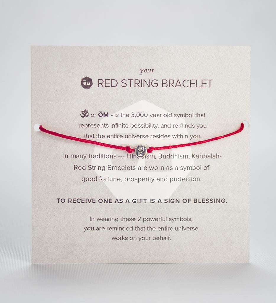 modern om red string bracelet front of packaging