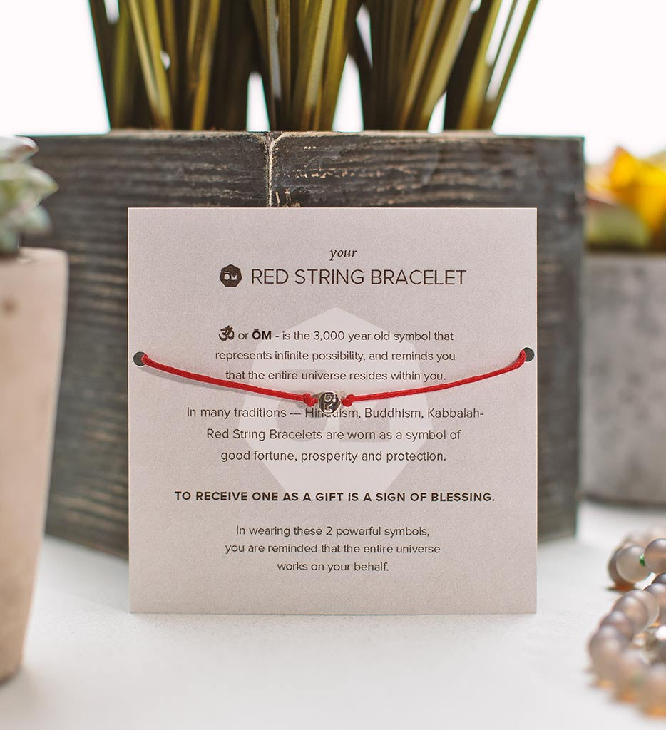 modern om red string bracelet packaging