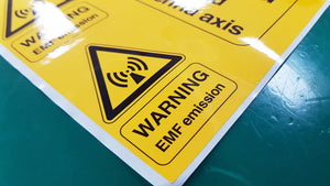 EMF emission warning sign, yellow on blue