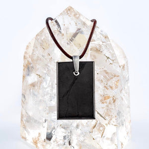 cool rectangular shungite pendant on a clear quartz stone